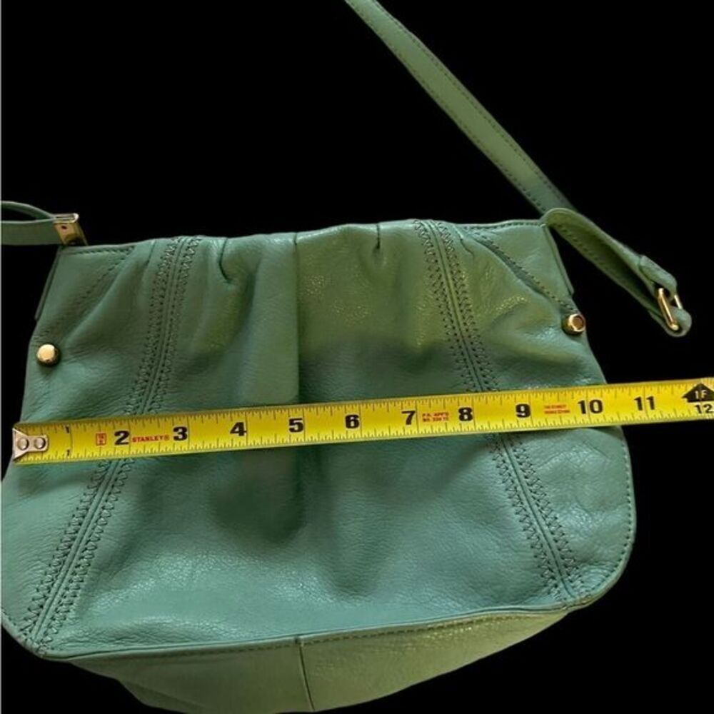 Absolutely adorable Perlina minty green crossbody leather bag…great quality! EUC